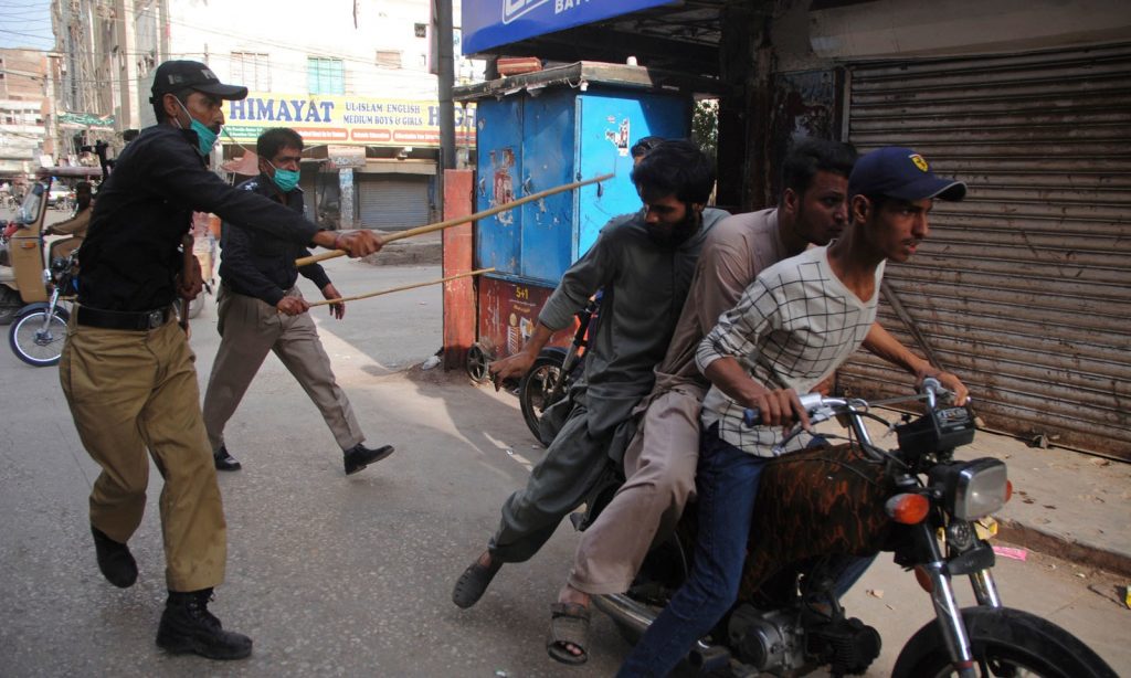 police beating boys on violating lockdown in karachi